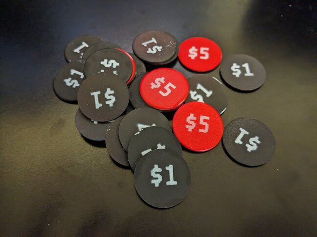 Painted, circular, chipboard tokens.